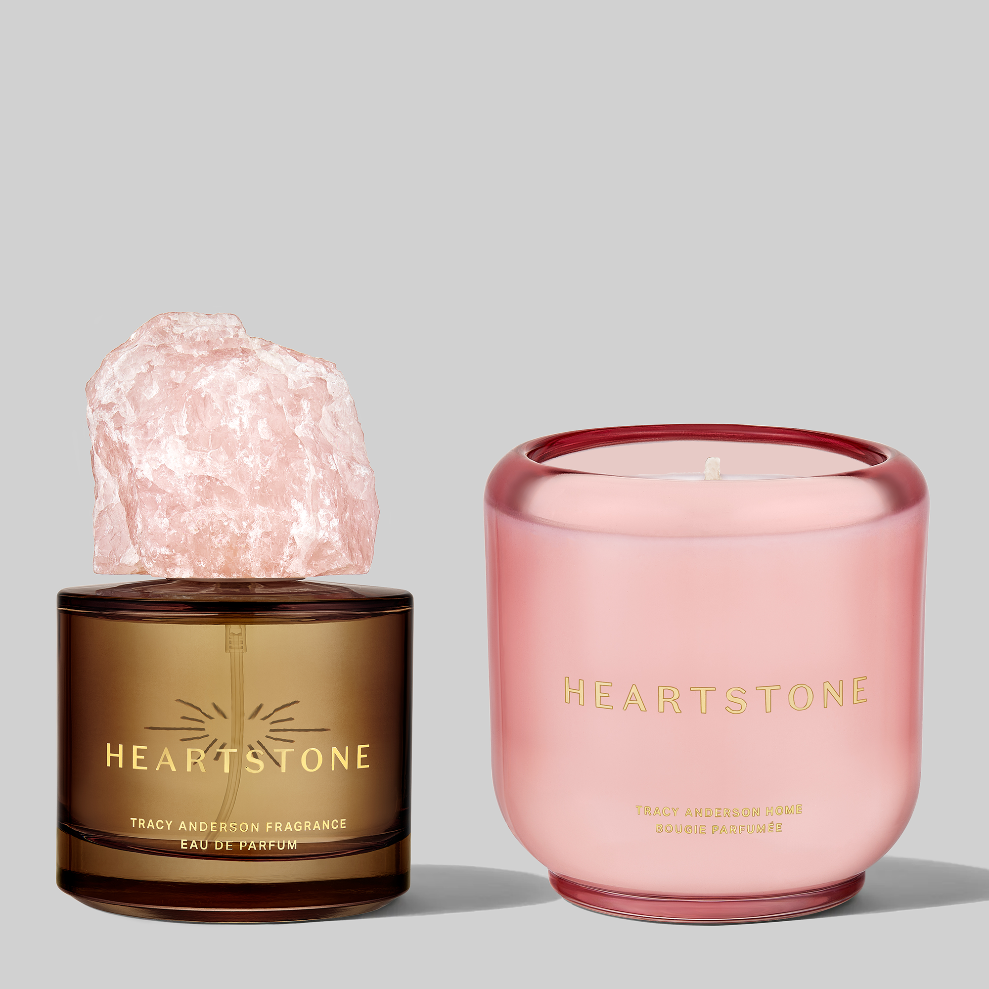 A close-up of the 3.4 fl oz HeartStone Eau de Parfum and 6.5 oz Scented Candle displayed side by side.